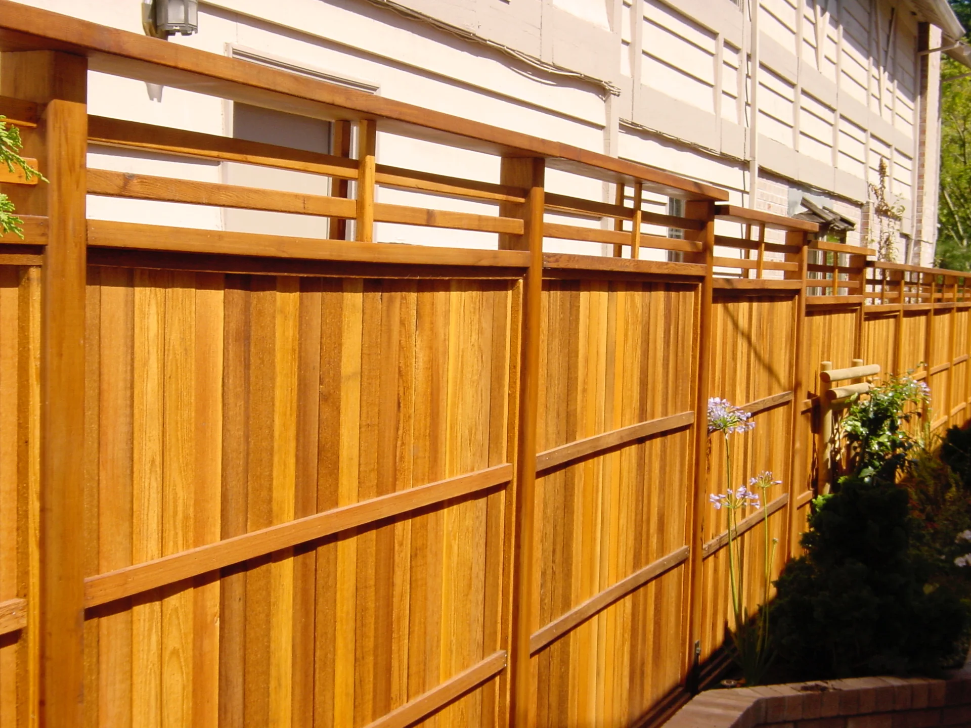 Custom cedar fence by Adrian's Quality Fencing and Decks