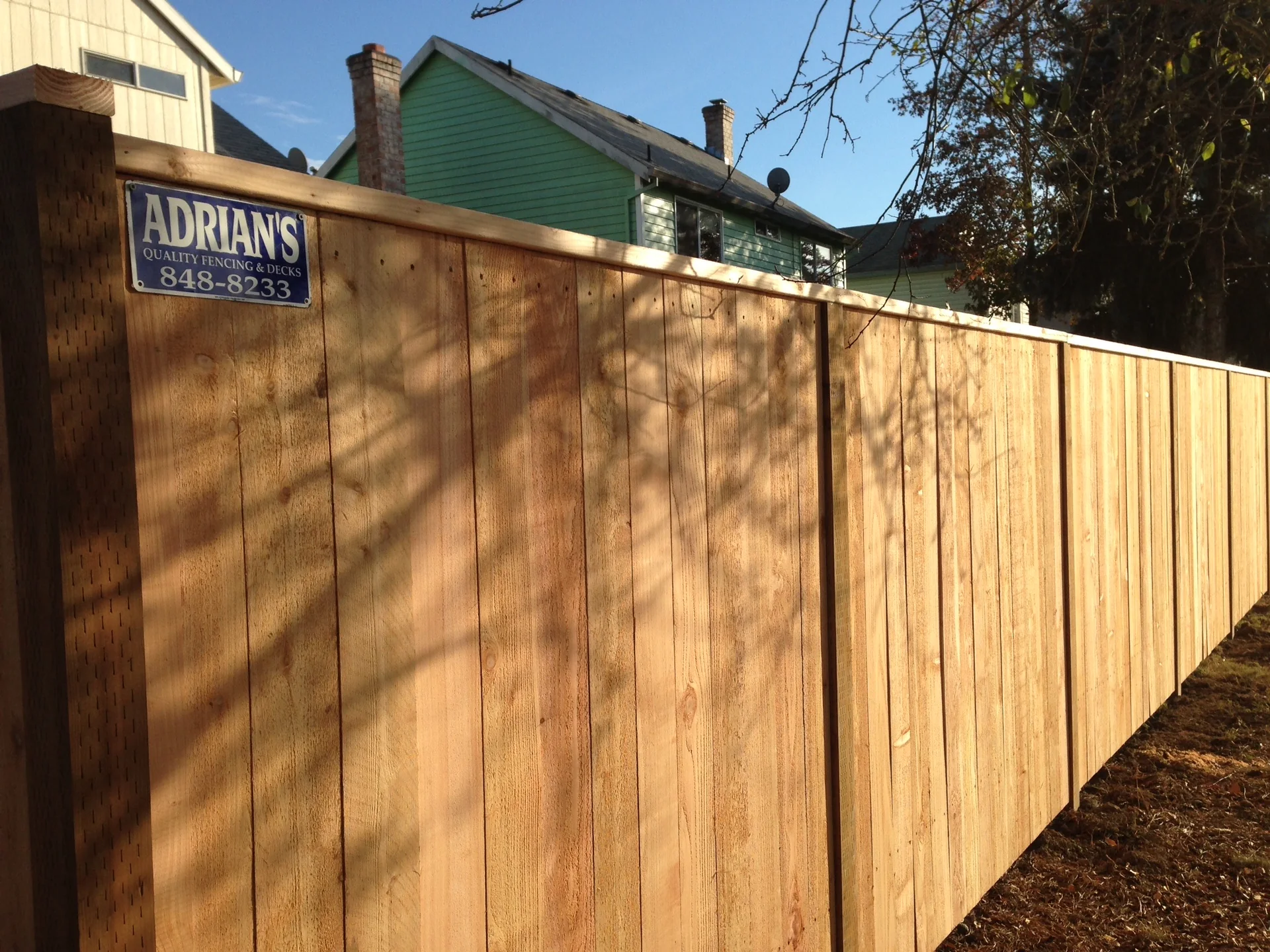 Solid cedar privacy by Adrian's Quality Fencing and Decks