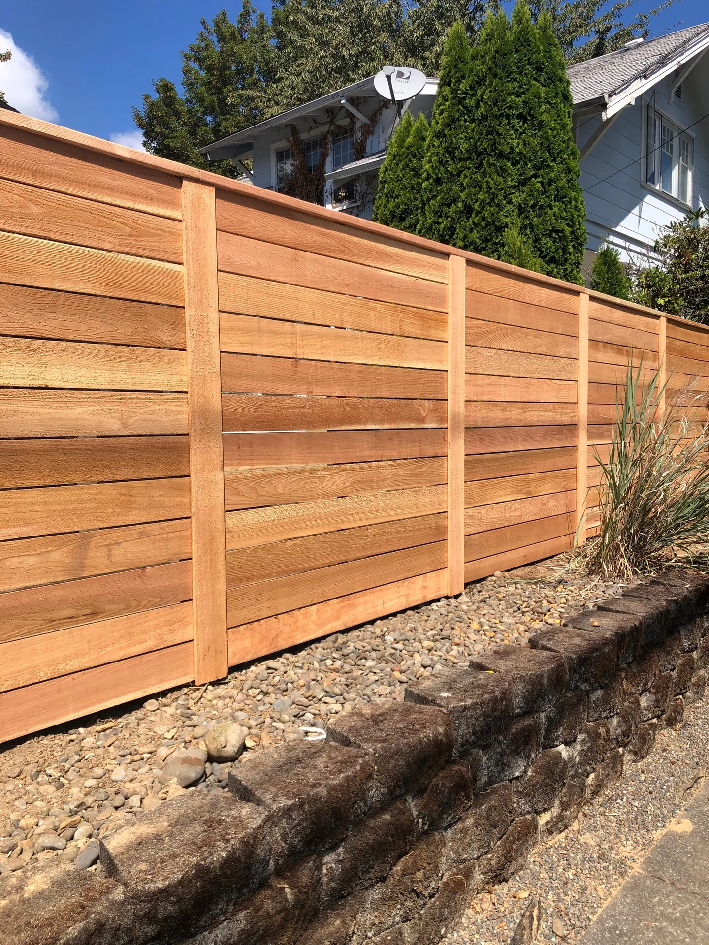 Horizontal cedar privacy by Adrian's Quality Fencing and Decks