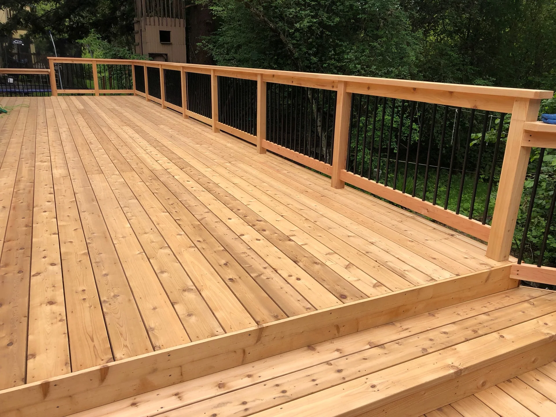 Finished cedar deck with black railing