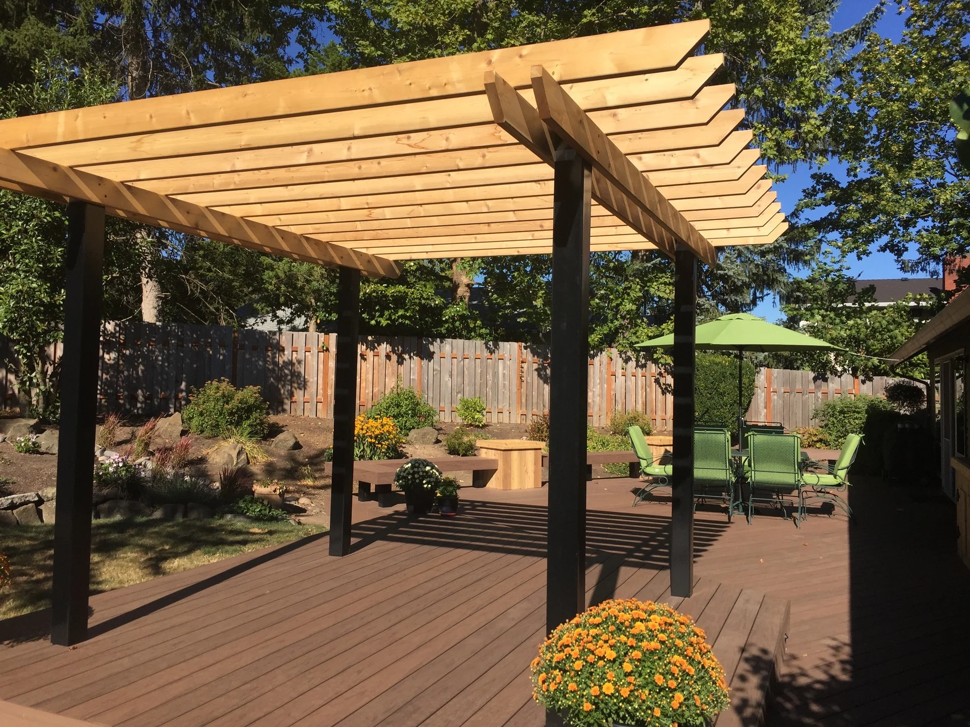 Cedar pergola built over a finished backyard patio
