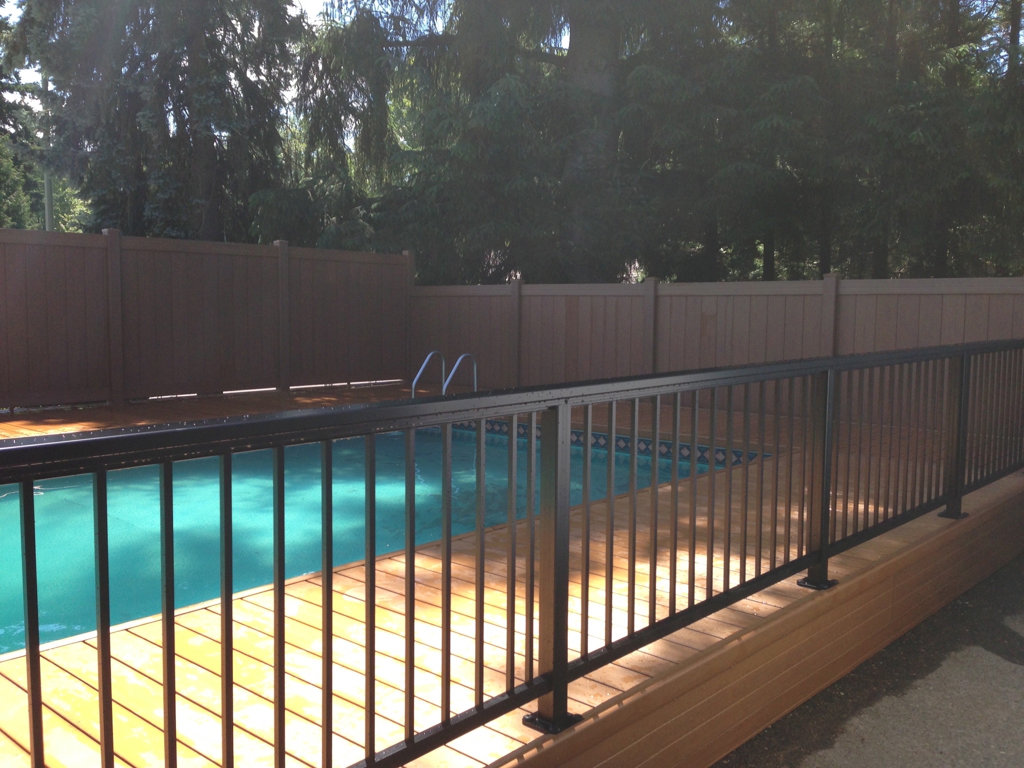 Poolside deck by Adrian's Quality Fencing and Decks